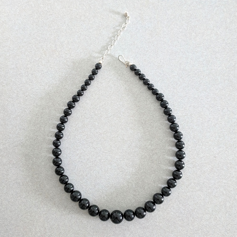 Black pearls necklace.